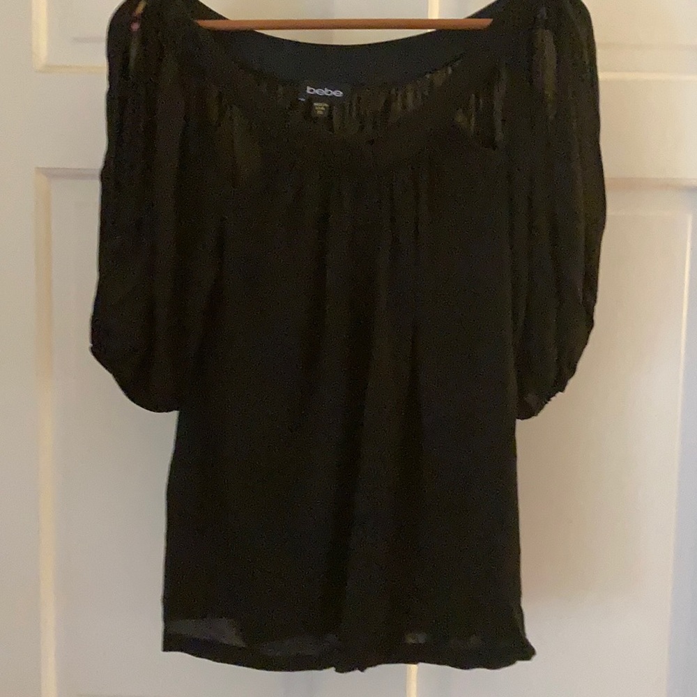 Bebe black blouse cut out sleeve & neckline.